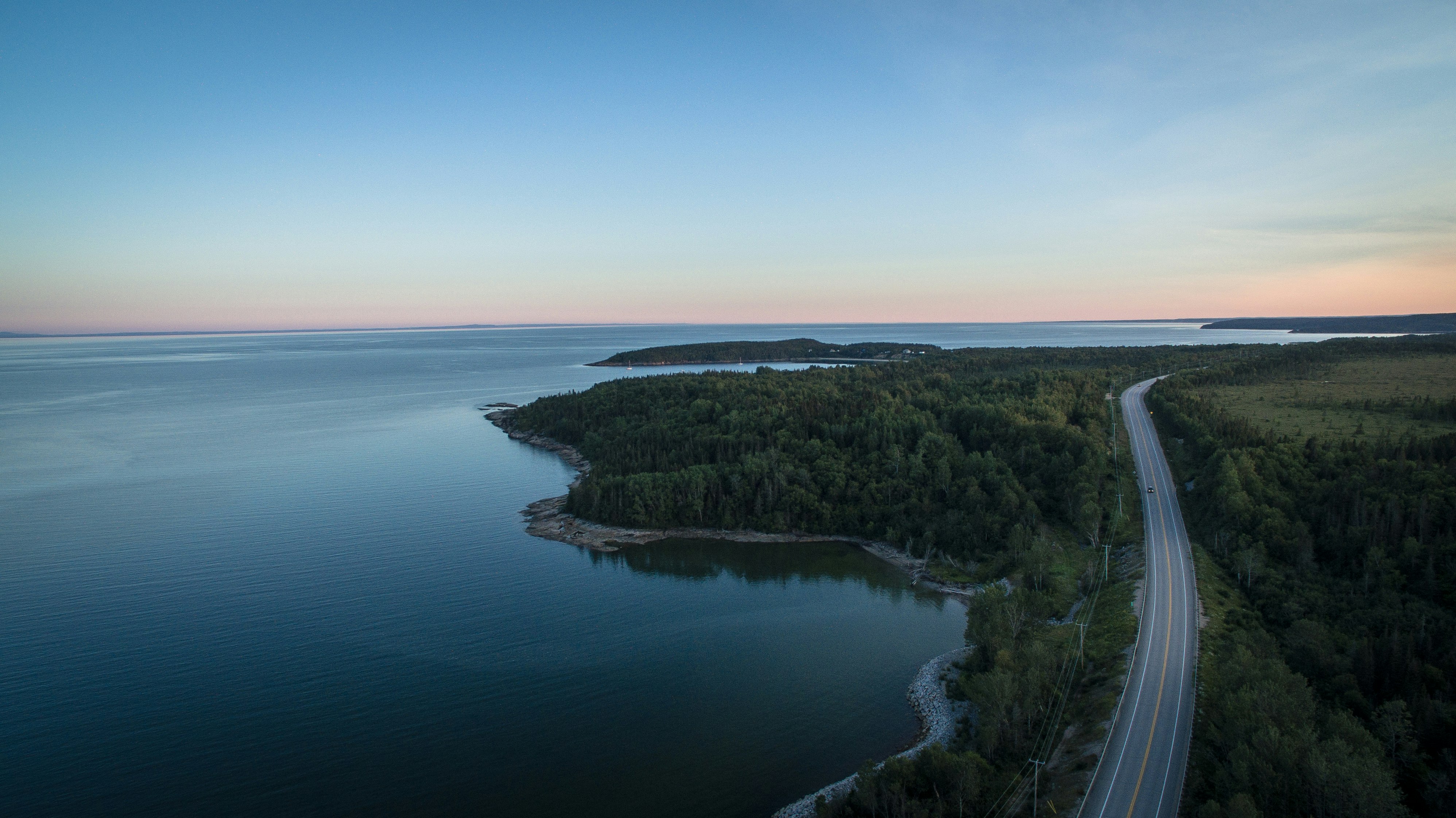- Part of a 30 days streak of Unsplash uploads -

This photo dates back from my road trip on the North Shore in Québec in 2015.
As we were trying to go as up north as possible for a chance to catch some northern lights, we stopped by a rest area by the road and by the river. 
I had had my DJI Phantom 3 Pro for only a couple of weeks, but was already in love with my new tool. 
The majestic landscapes only got more breathtaking when taken from dozens of feet up in the sky.

Jp Valery is one of the best photographers in Montréal, QC and can be contacted at contact@jpvalery.photo.