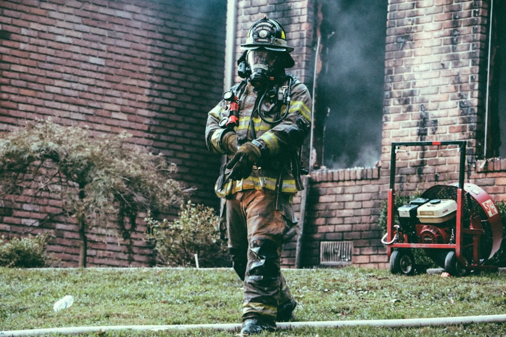 fireman holding his hand