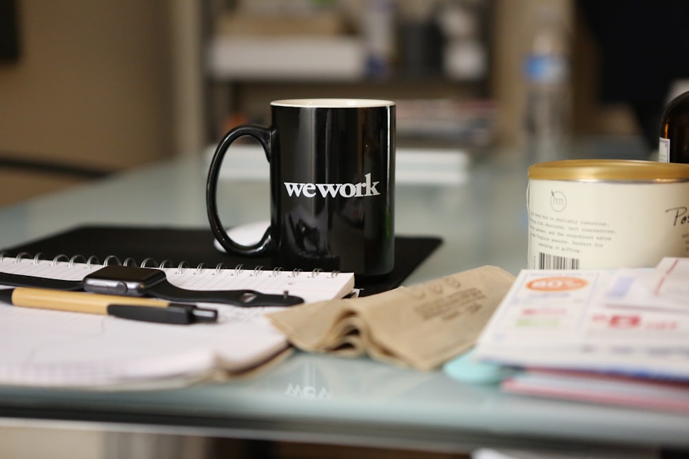 black ceramic mug on book