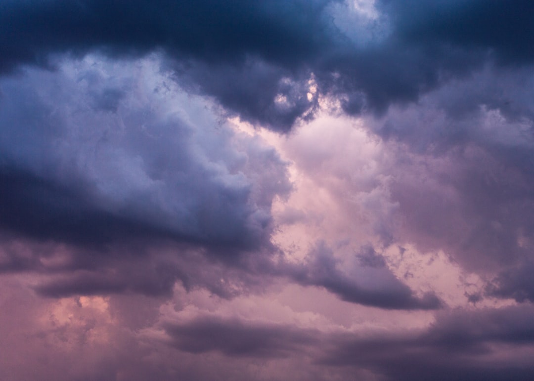 low angle of blue and pink cloudy sky