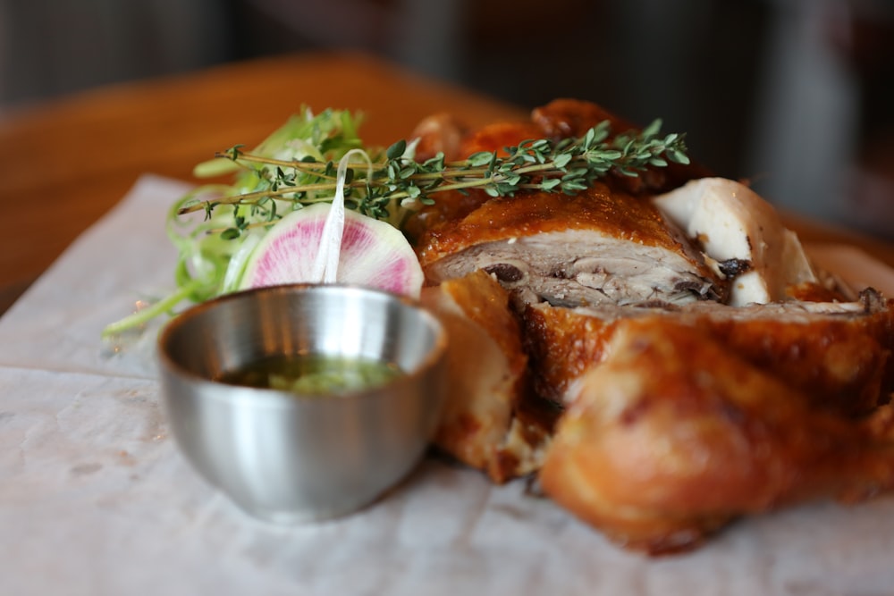 stainless steel bowl and roasted chicken