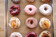 A colorful assortment of seasonal donuts on display.