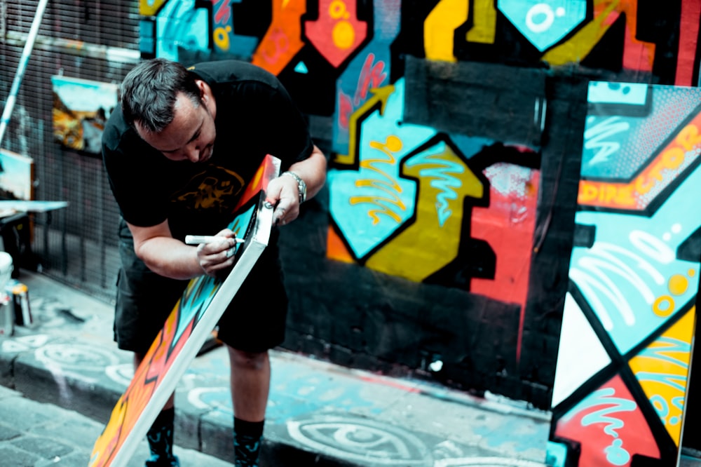 man doing graffiti