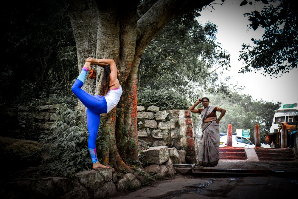 woman standing beside tree