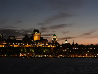 Historic city skyline glowing under the warm light of dusk.