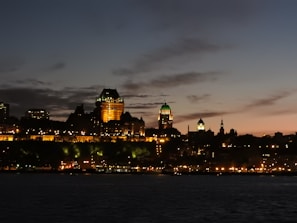 Historic city architecture glowing warmly under the evening lights.