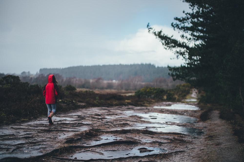 person standing on brown surface