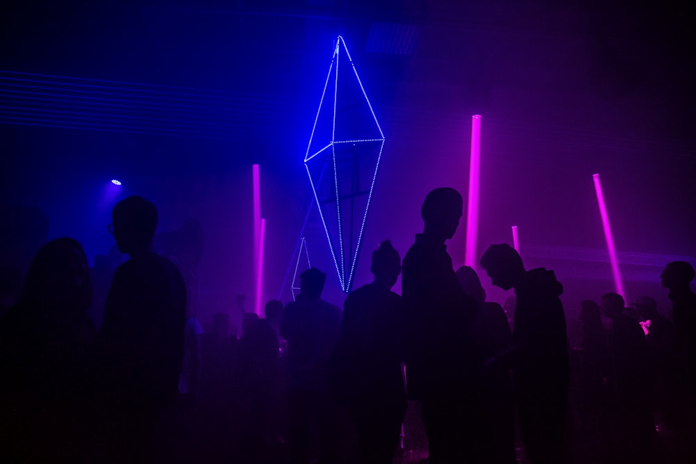 silhouette photography of people gathered inside bar