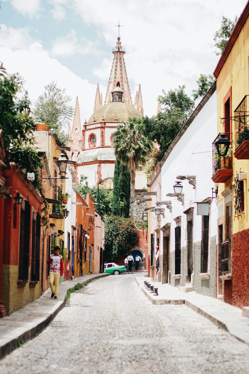 narrow road heading toward church