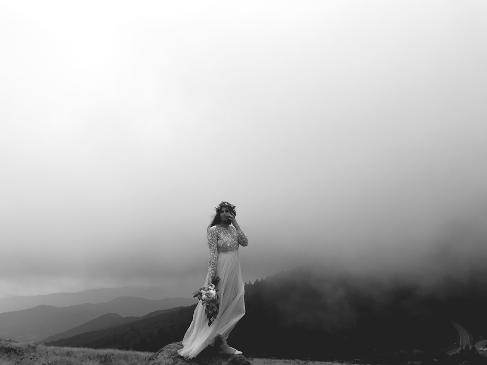 grayscale photo of person in maxi dress