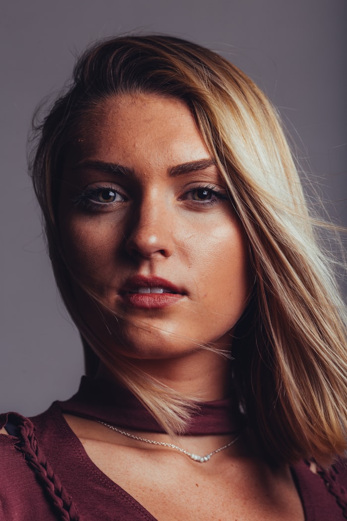 Historic Italian Catholic church facade with ornate stone carvings and bell tower