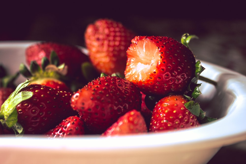 bunch of strawberries in white bowl