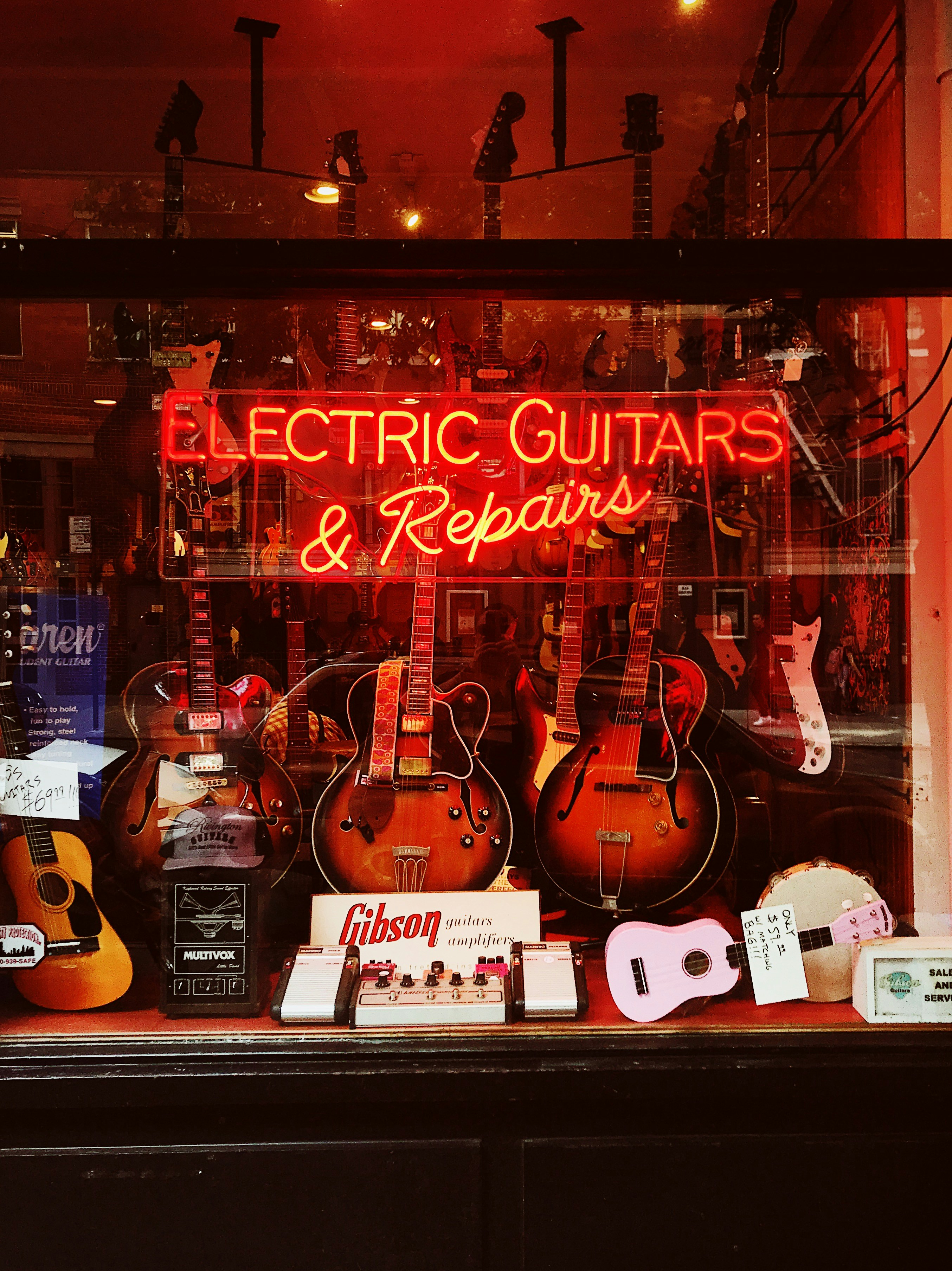 red Electric Guitars neon-light signage