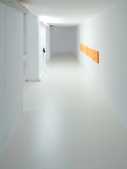 empty hallway between white walls