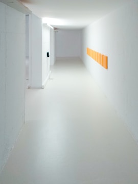empty hallway between white walls
