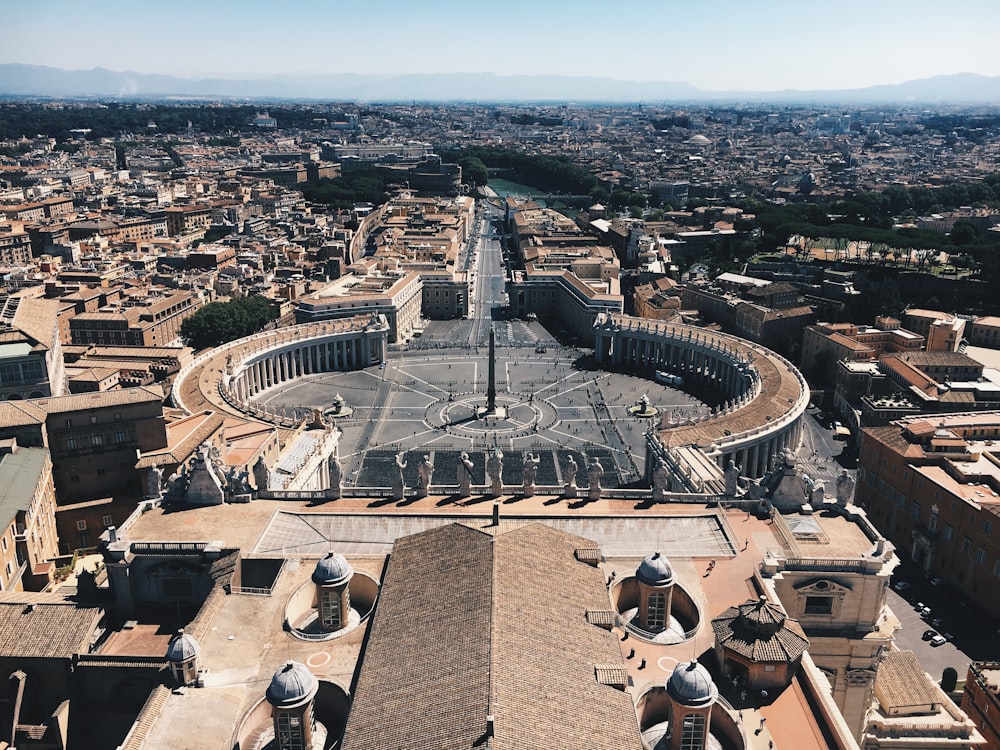 aerial photography of building statue surrounded by buildings