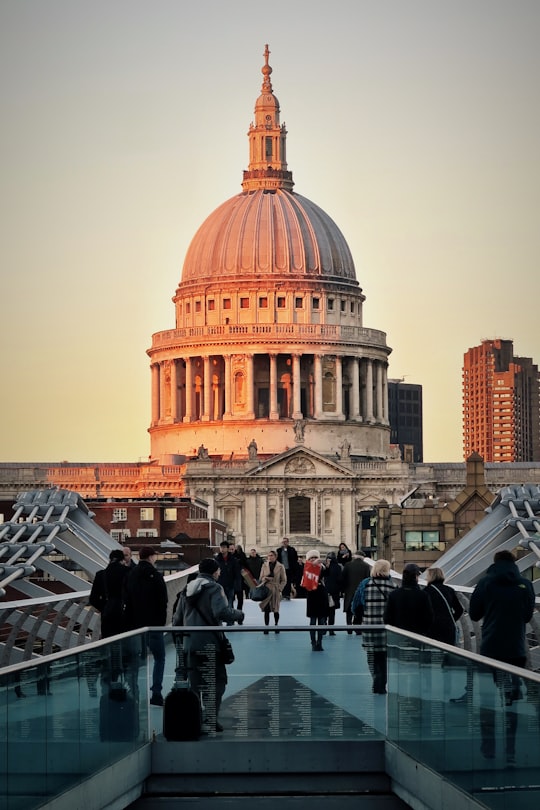 people walking near white concrete dome building at daytime in St. Paul's Cathedral United Kingdom