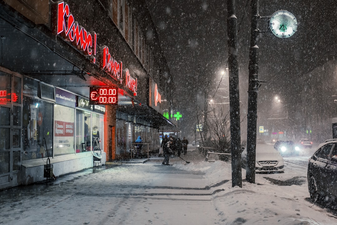 red neon store facade, Snowfall in Moscow