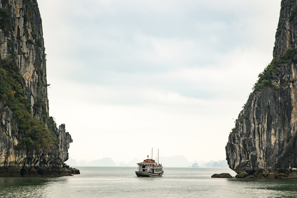 white watercraft on body of water