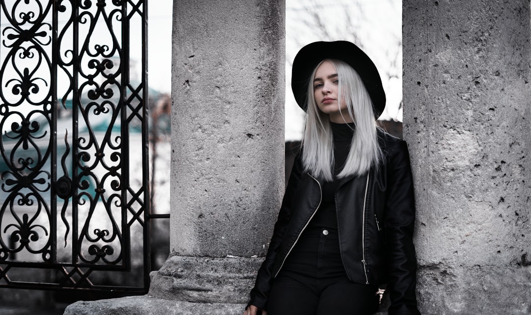 Fashion girl in a hat with white hair