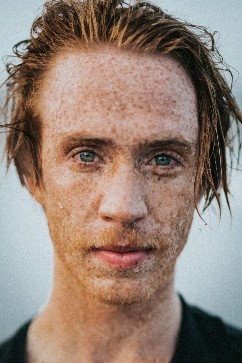 closeup photo of man's face with marks