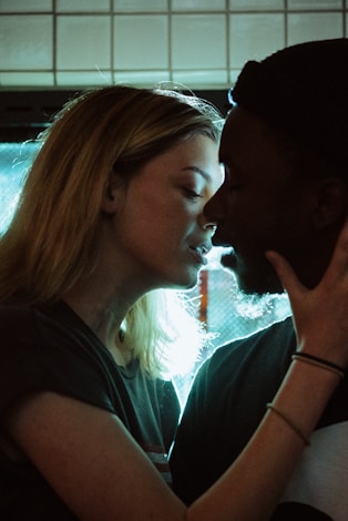 woman about to kiss man