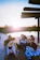 A cozy wooden deck at sunset with friends enjoying a warm sauna session.