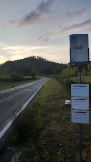 A photo depicting the installation of road signs in a rural area.