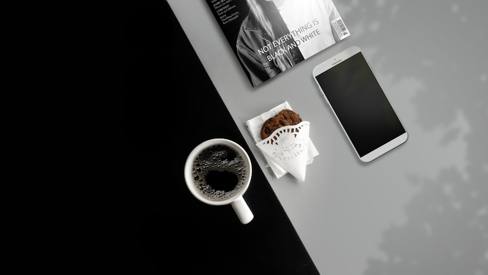 white ceramic mug filled with black liquid