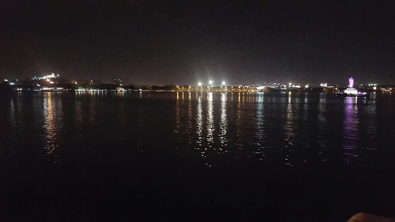 Night view of Sakarya city lights reflecting on the water