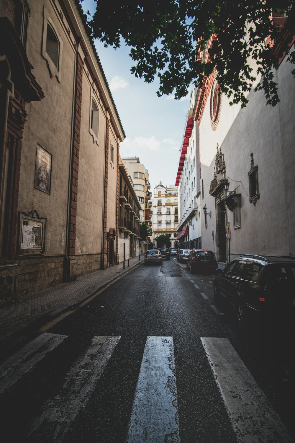 cars parked on side of the road during daytime