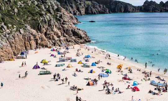 group of people at the seashore photo during daytime in Penwith Heritage Coast United Kingdom