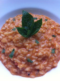 A rich and creamy risotto served in a bowl.