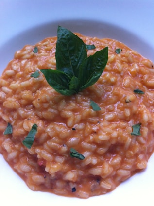 Vibrant jars of risotto with colorful vegetables and fresh ingredients visible