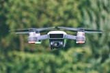 selective focus photography of gray drone