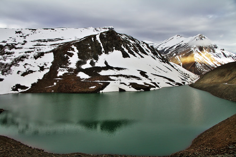 mountain near body of water