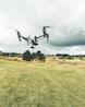 turned on white and black quadcopter drone