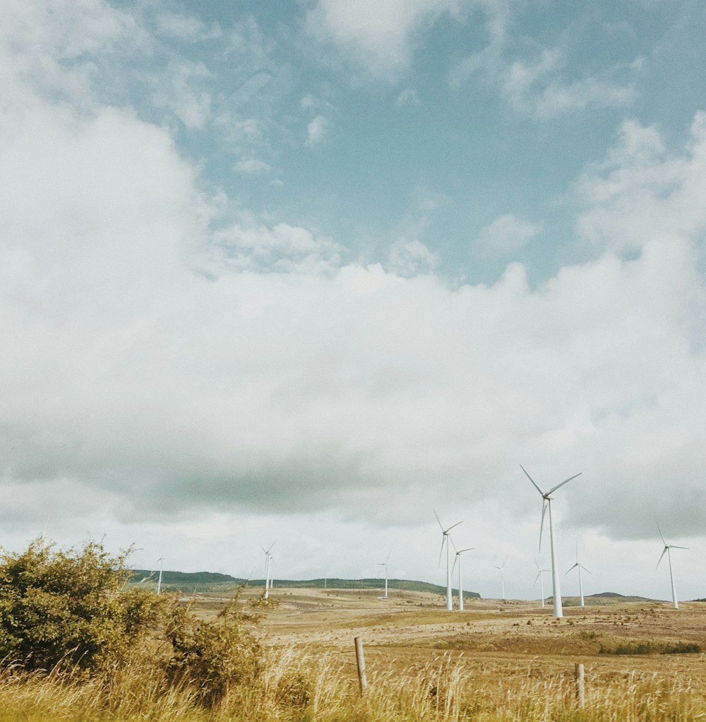 landscape photography of white wind mills