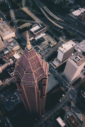 An aerial view of a completed high-rise building in an urban setting.