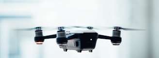 black quadcopter drone selective focus photograph