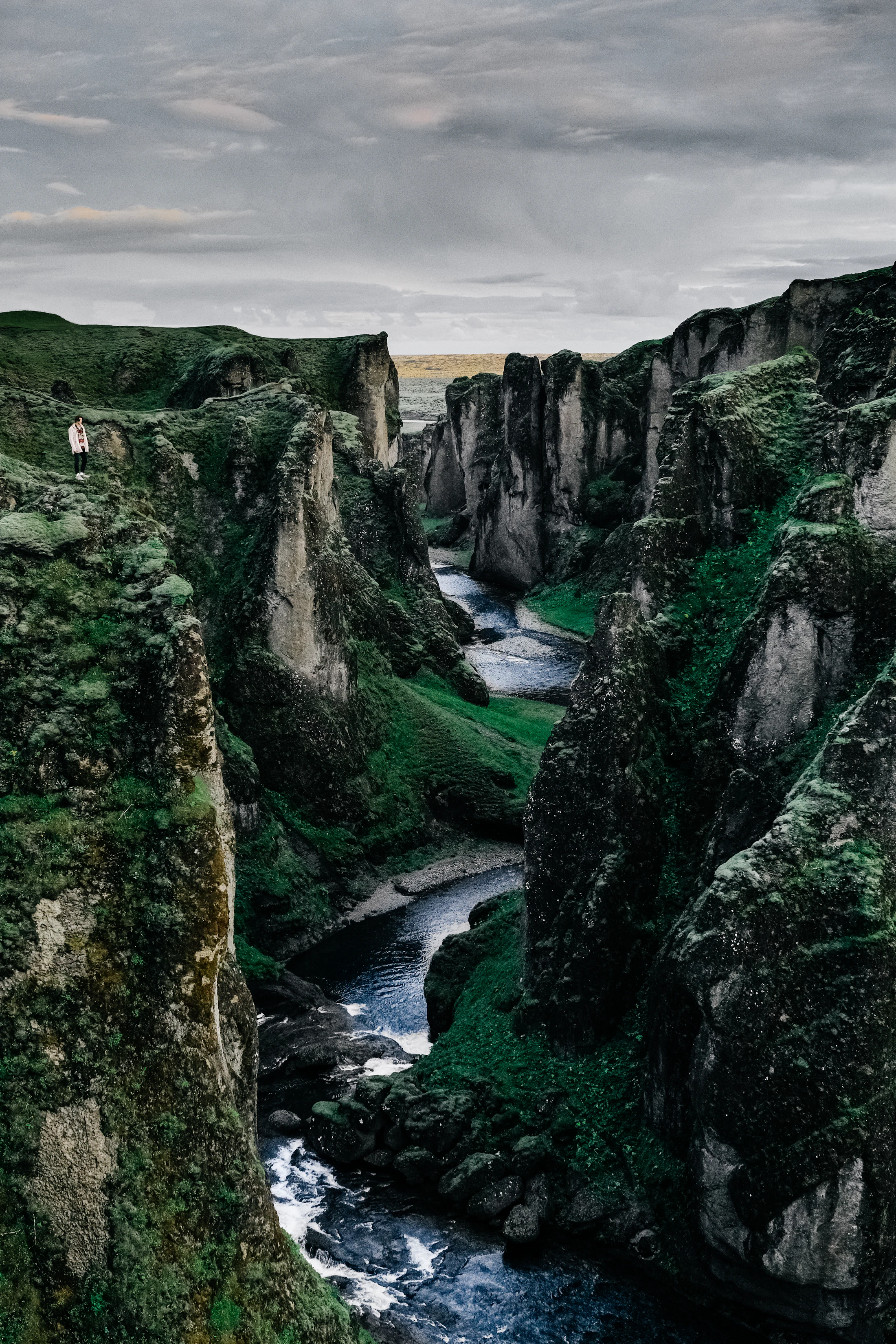 River winding through a moss-green canyon in south Iceland