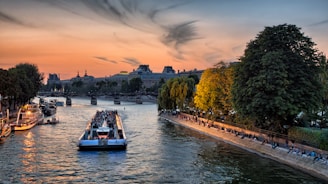 Happy travelers enjoying a Nile river cruise at sunset.