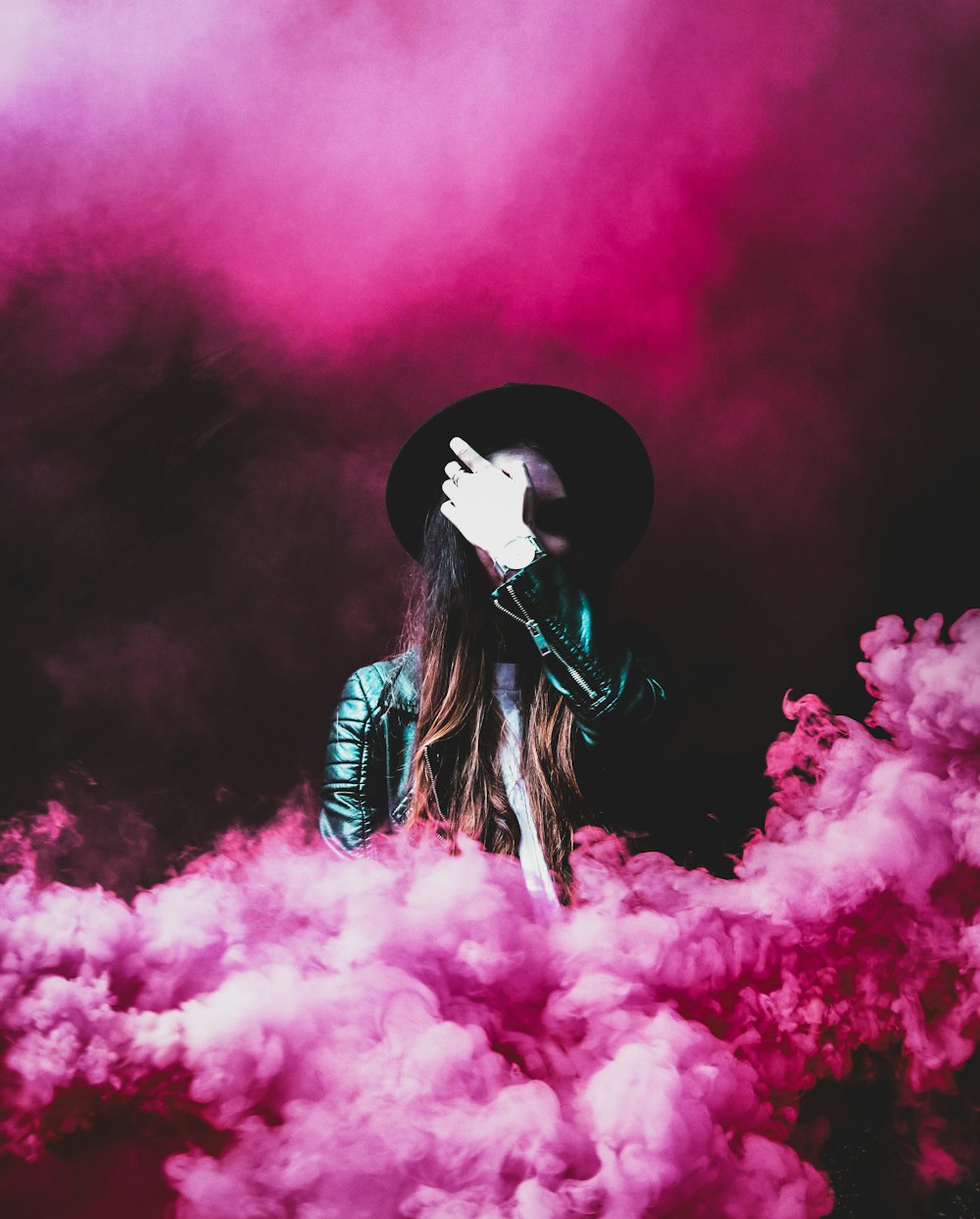 person standing around pink smokes