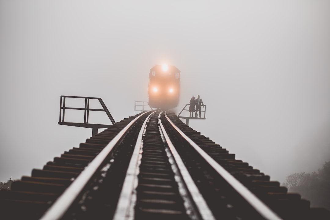 man and woman standing beside trailway, This shot was made with screams of “get out of there!” :)