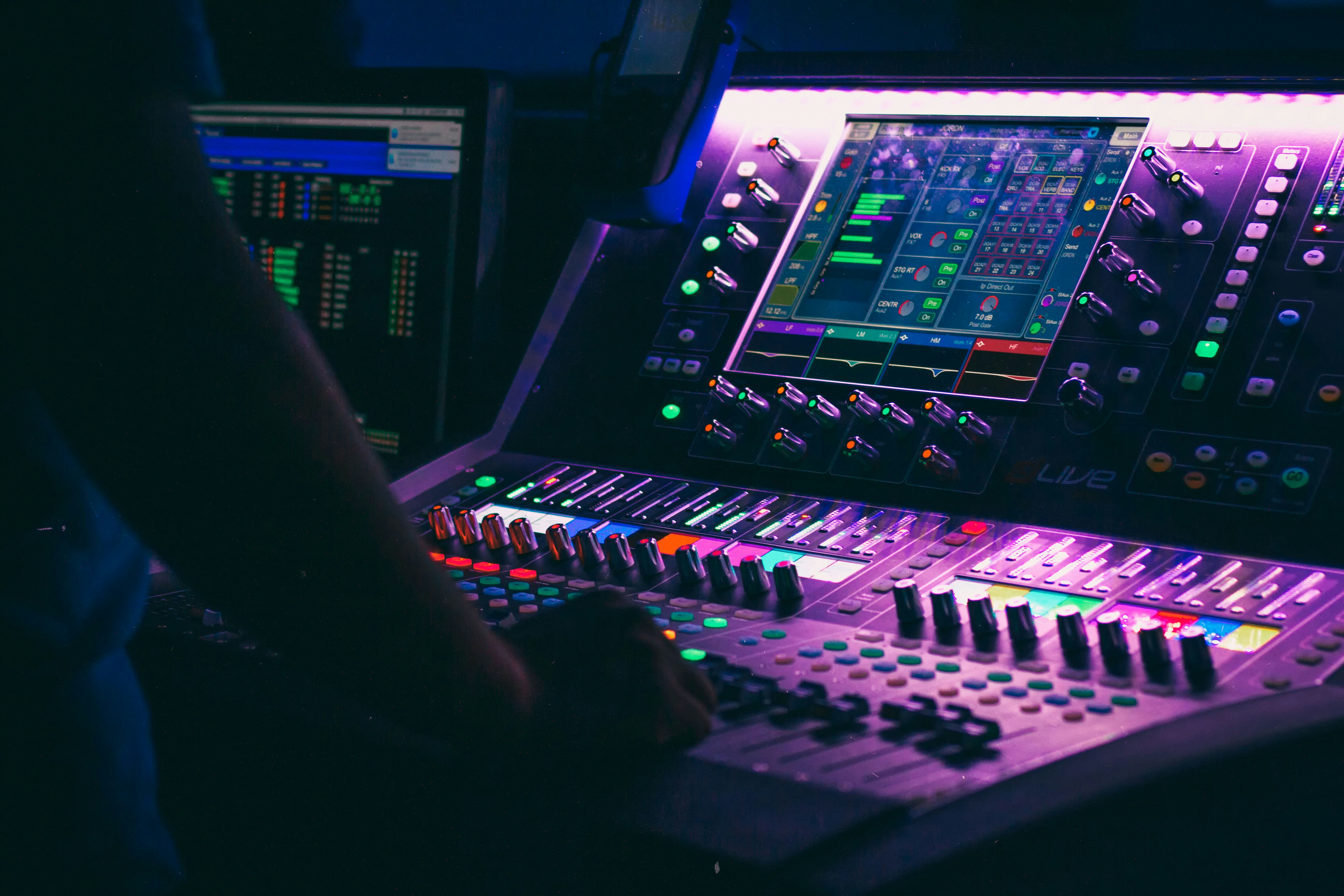 sound designer working with audio synthesizer waveform display