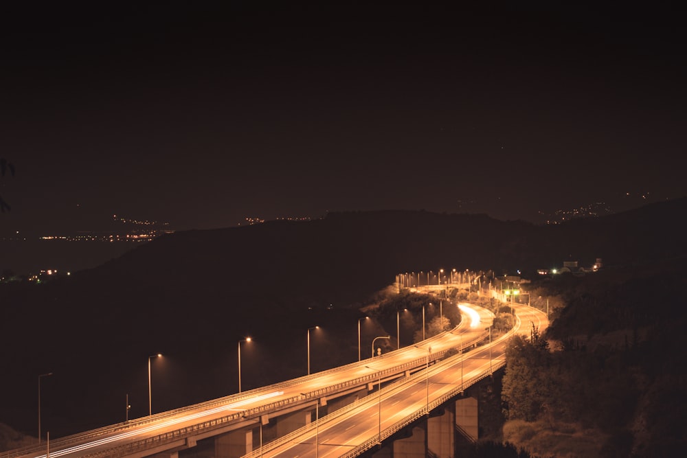 time lapse photography of yellow road at night