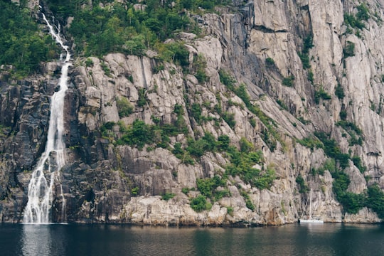 body of water near waterfall and mountain in Lysefjord Norway