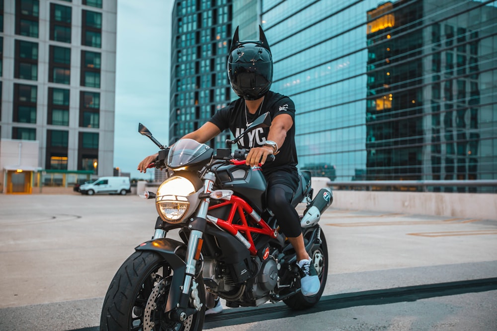 man riding naked motorcycle with helmet on