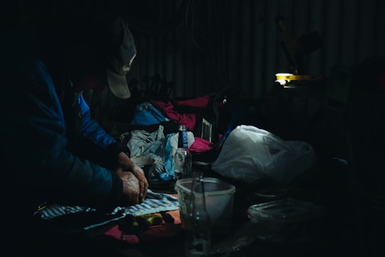 A designer working on a clothing pattern at a bright workspace.