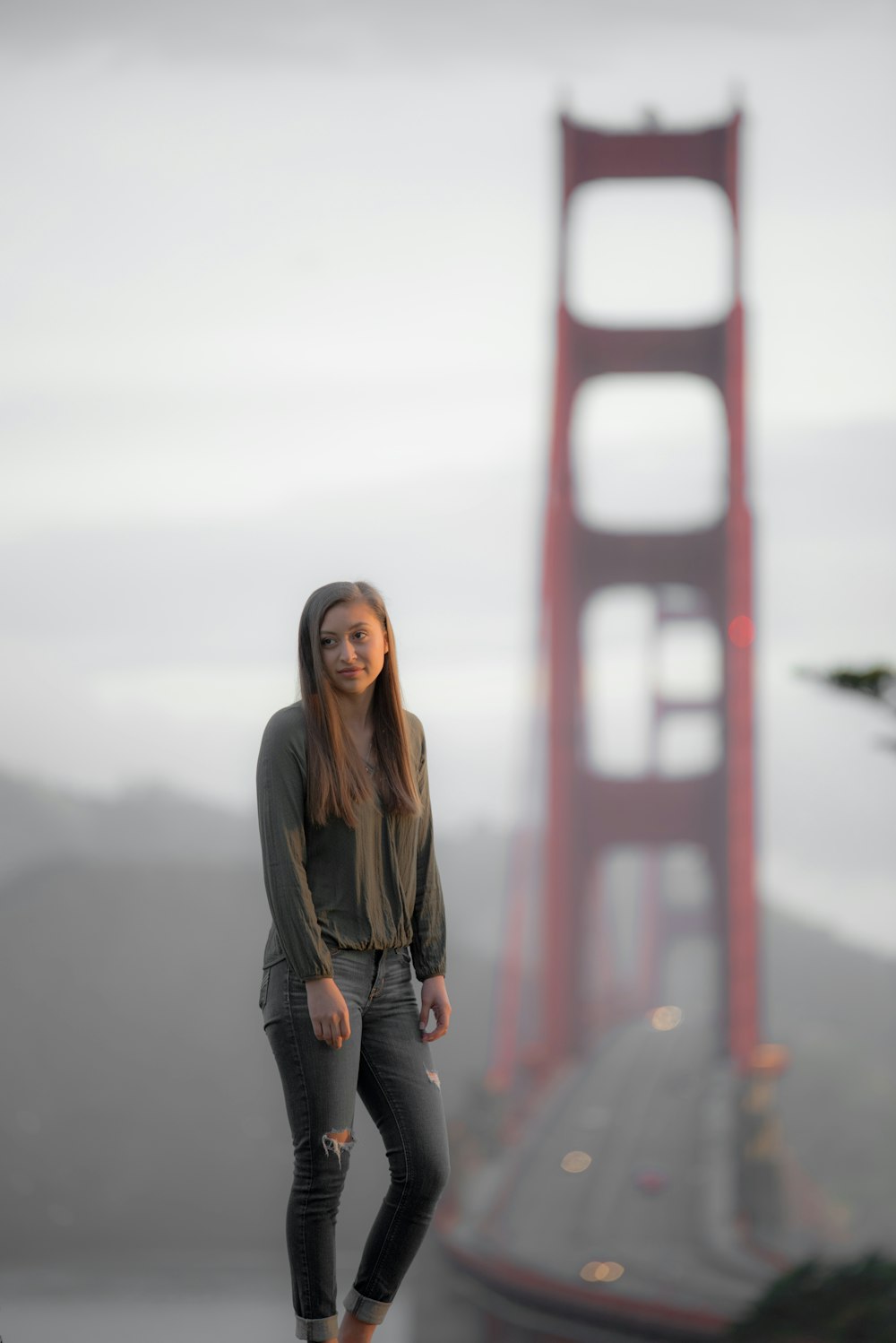 woman standing near bridge